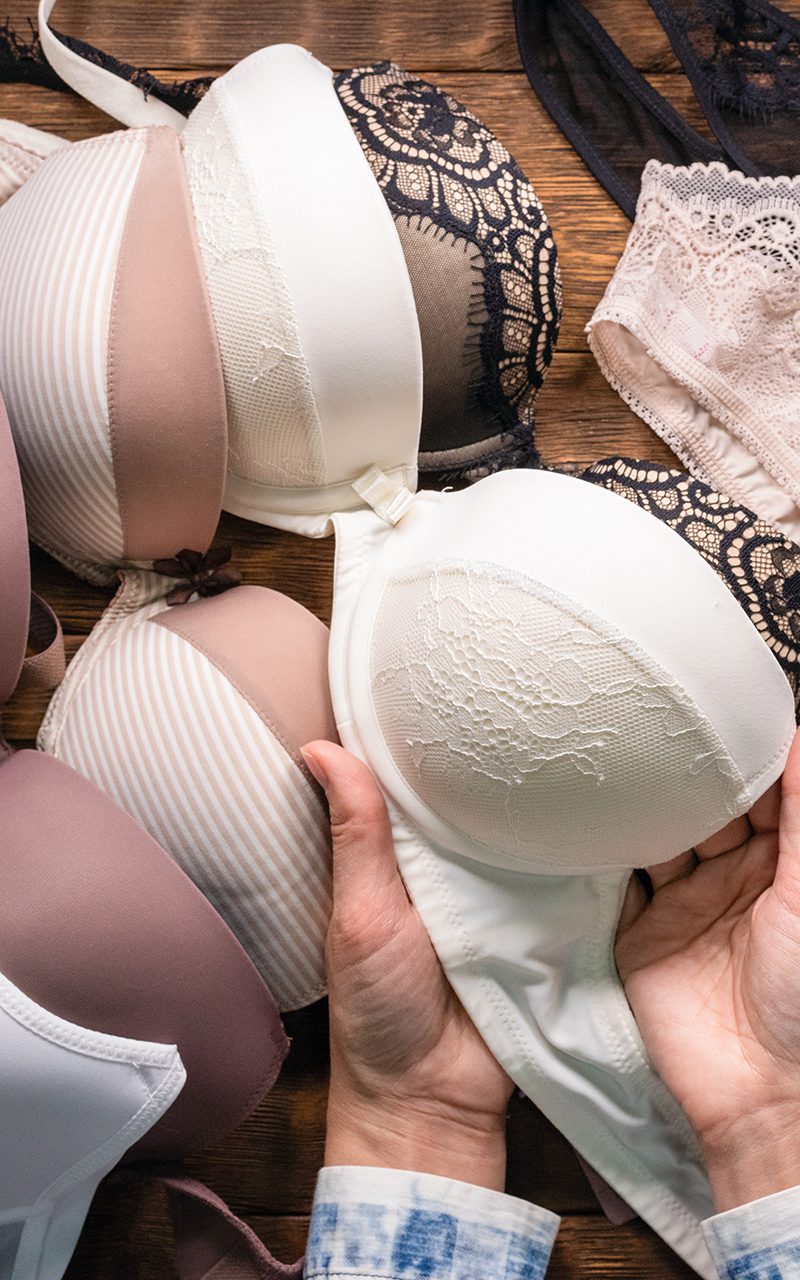 Woman is choosing a new underwear in a lingerie shop. Woman is choosing a new underwear in a lingerie shop.